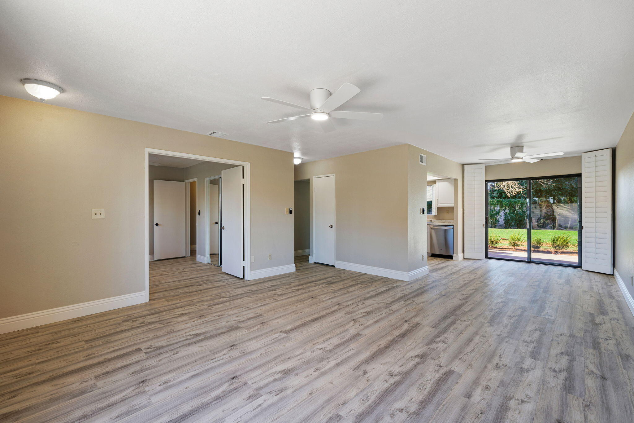 41045 Largo Palm Desert, CA 92211 - Photo 11 of 46 a view of an empty room with window and wooden floor