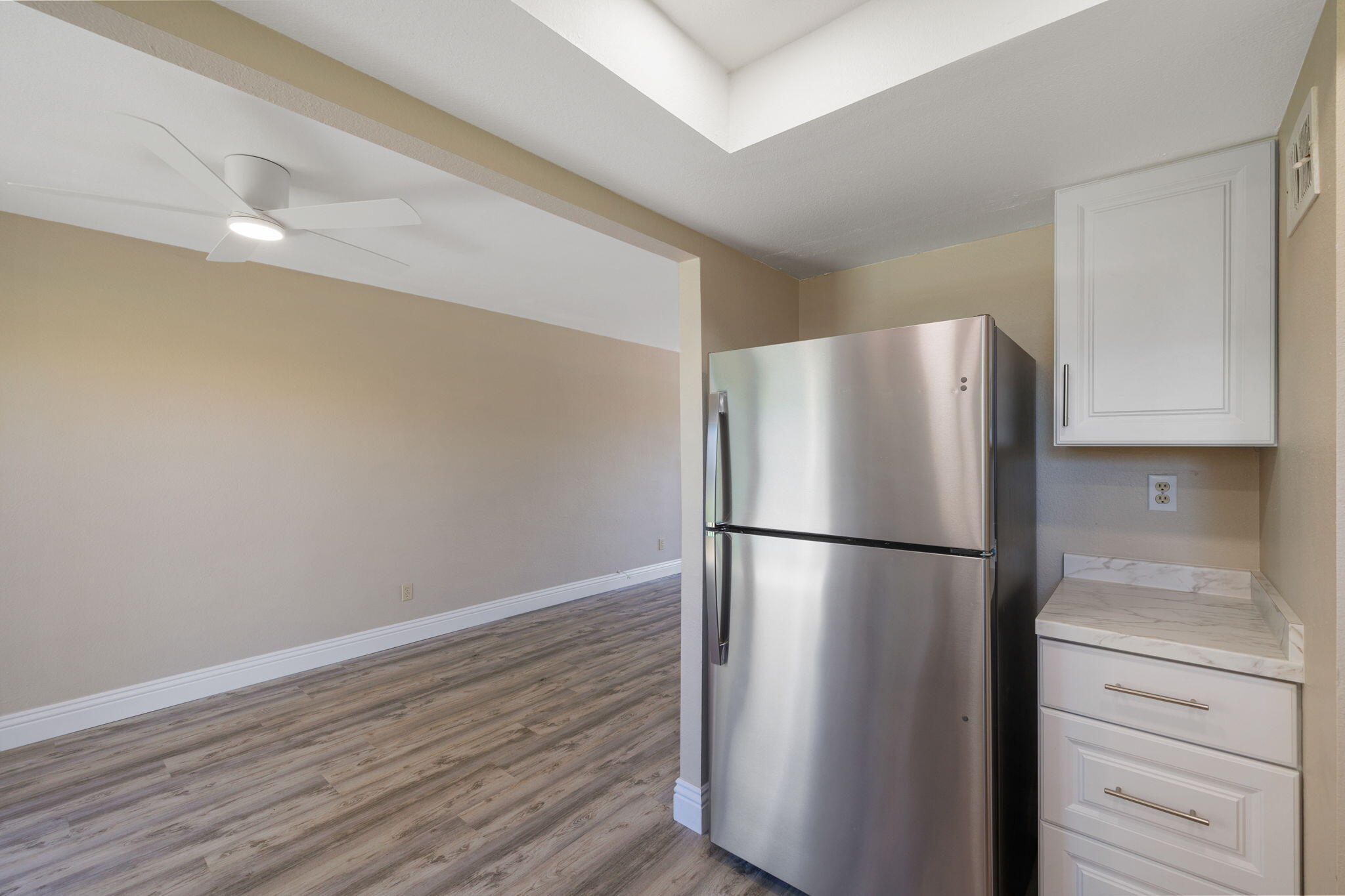 41045 Largo Palm Desert, CA 92211 - Photo 18 of 46 a white refrigerator freezer and a stove sitting inside of a kitchen