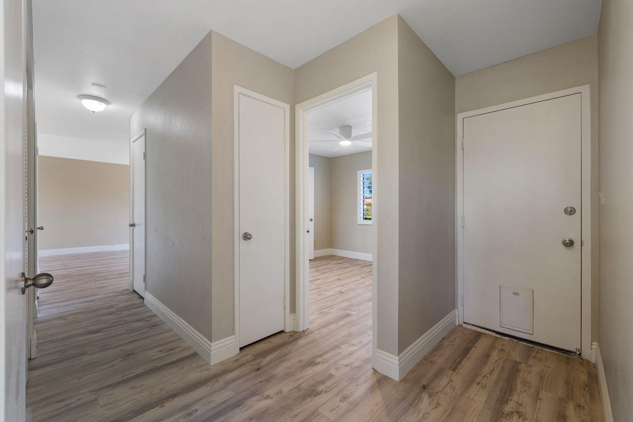 41045 Largo Palm Desert, CA 92211 - Photo 21 of 46 a view of a hallway with wooden floor