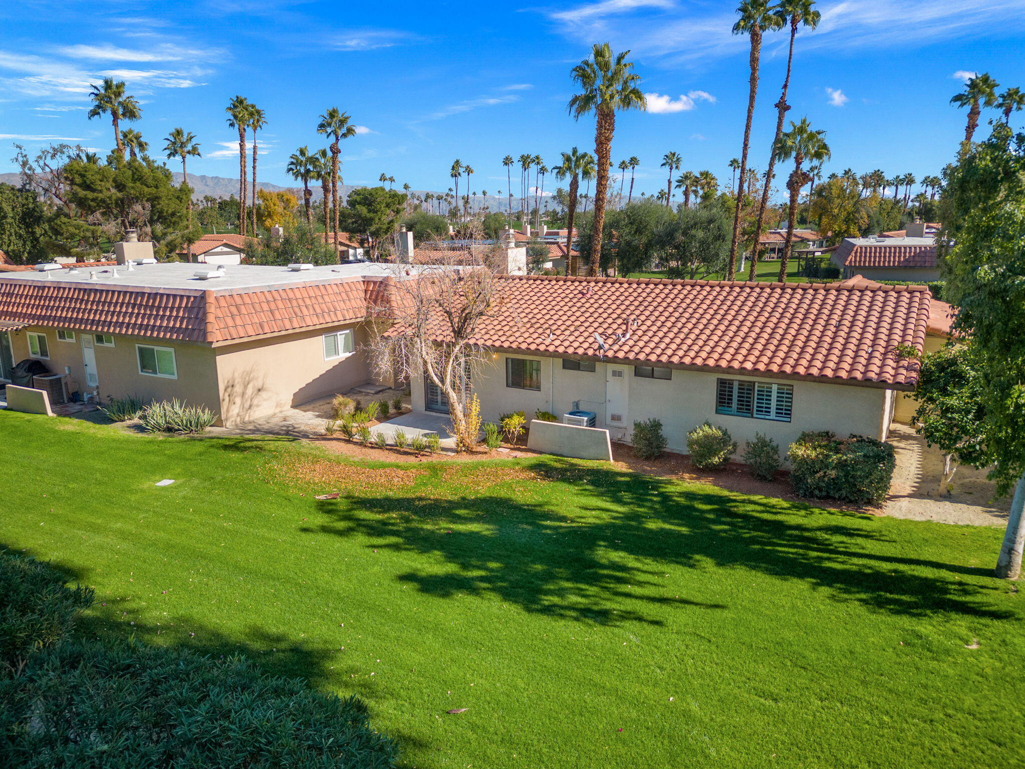 41045 Largo Palm Desert, CA 92211 - Photo 36 of 46 a view of a house with a yard