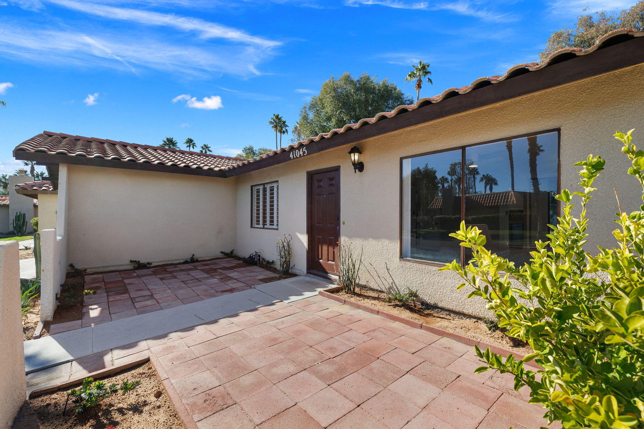41045 Largo Palm Desert, CA 92211 - Photo 7 of 46 a view of a house with patio