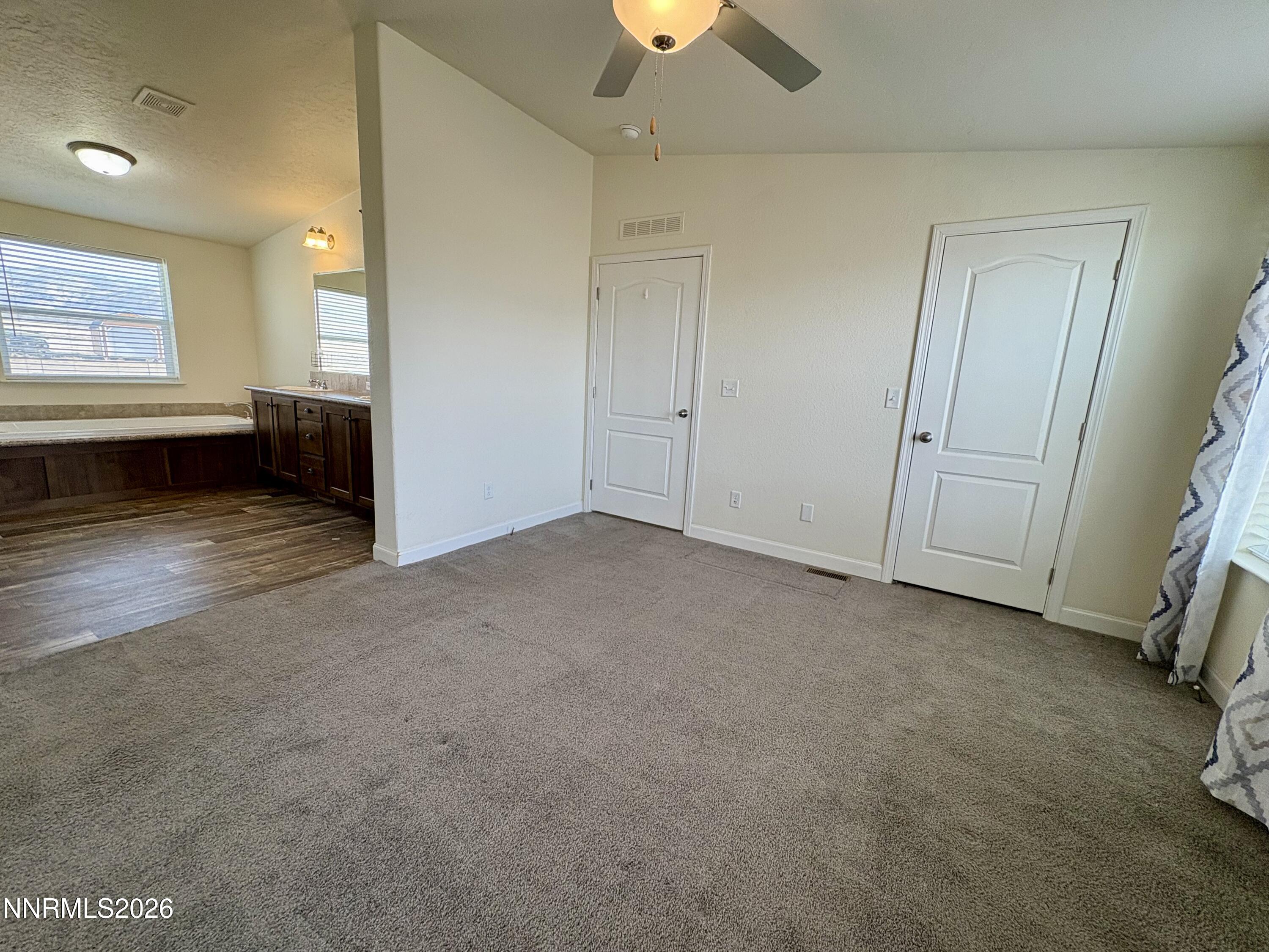 1415 Van Diest Road Winnemucca, NV 89445 - Photo 15 of 34 an empty room with windows and closet
