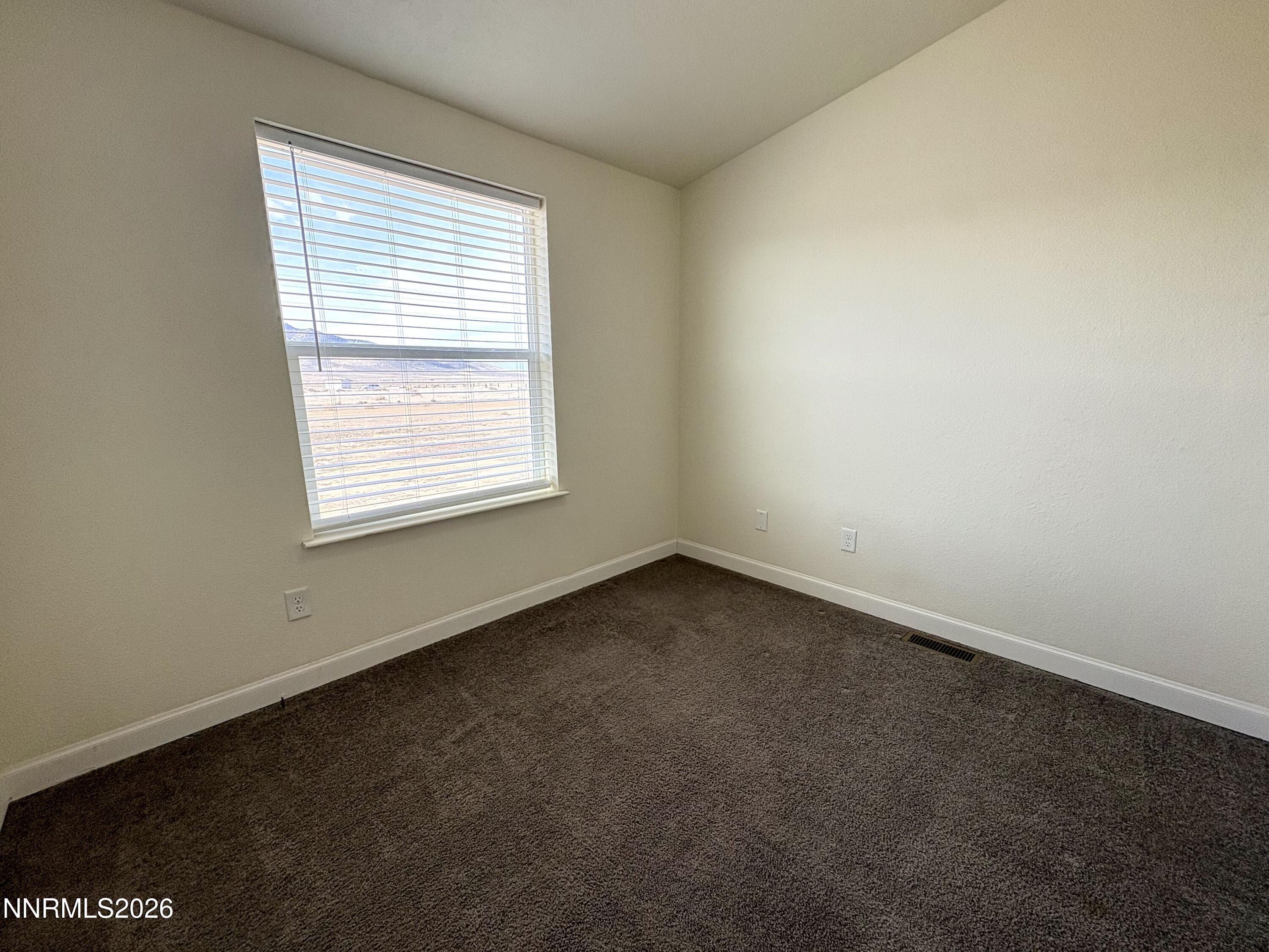 1415 Van Diest Road Winnemucca, NV 89445 - Photo 26 of 34 an empty room with a window