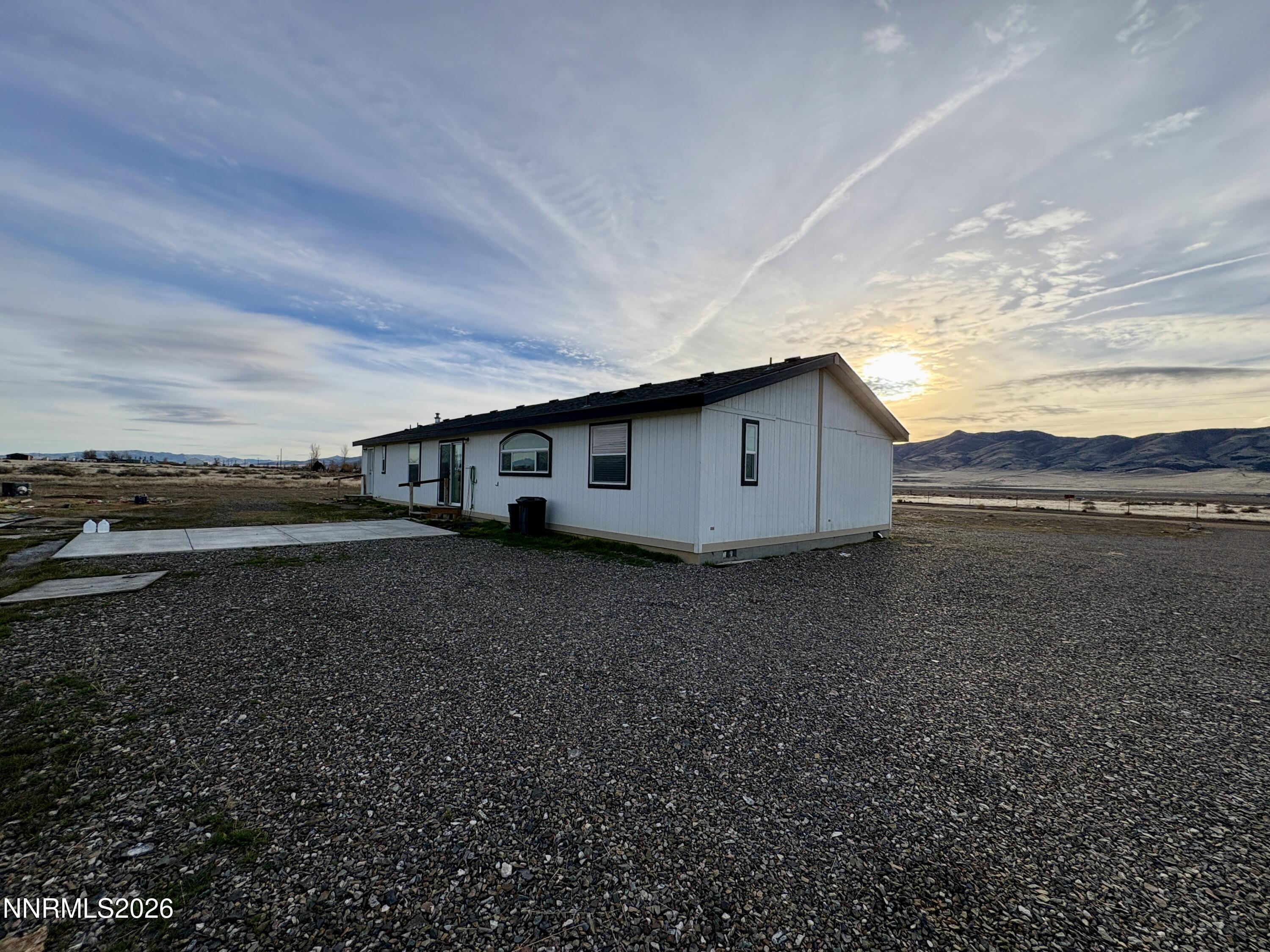 1415 Van Diest Road Winnemucca, NV 89445 - Photo 30 of 34 a view of a house with a yard