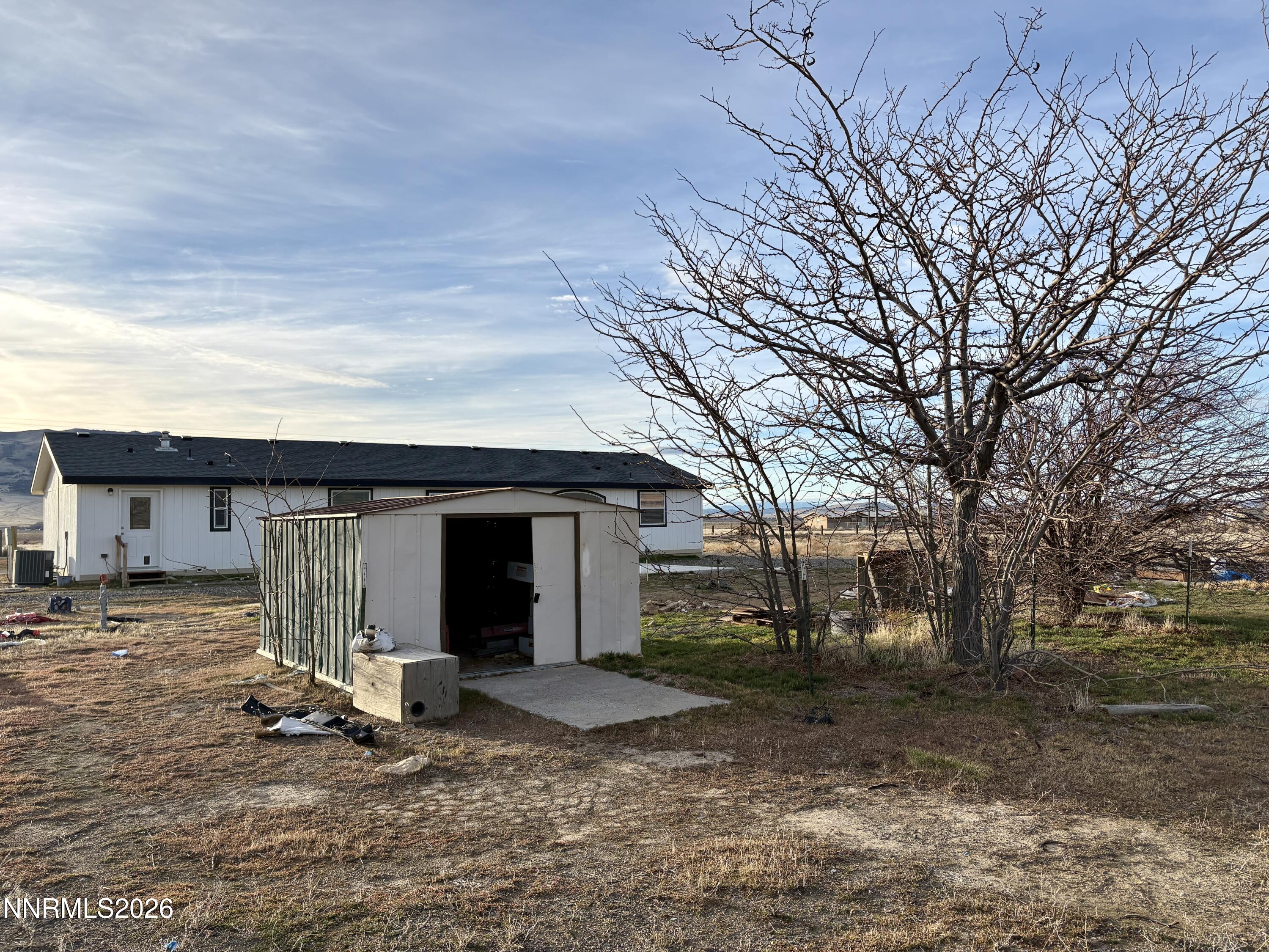 1415 Van Diest Road Winnemucca, NV 89445 - Photo 32 of 34 a front view of a house with garden