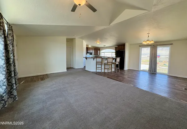 a view of a livingroom with furniture and a chandelier