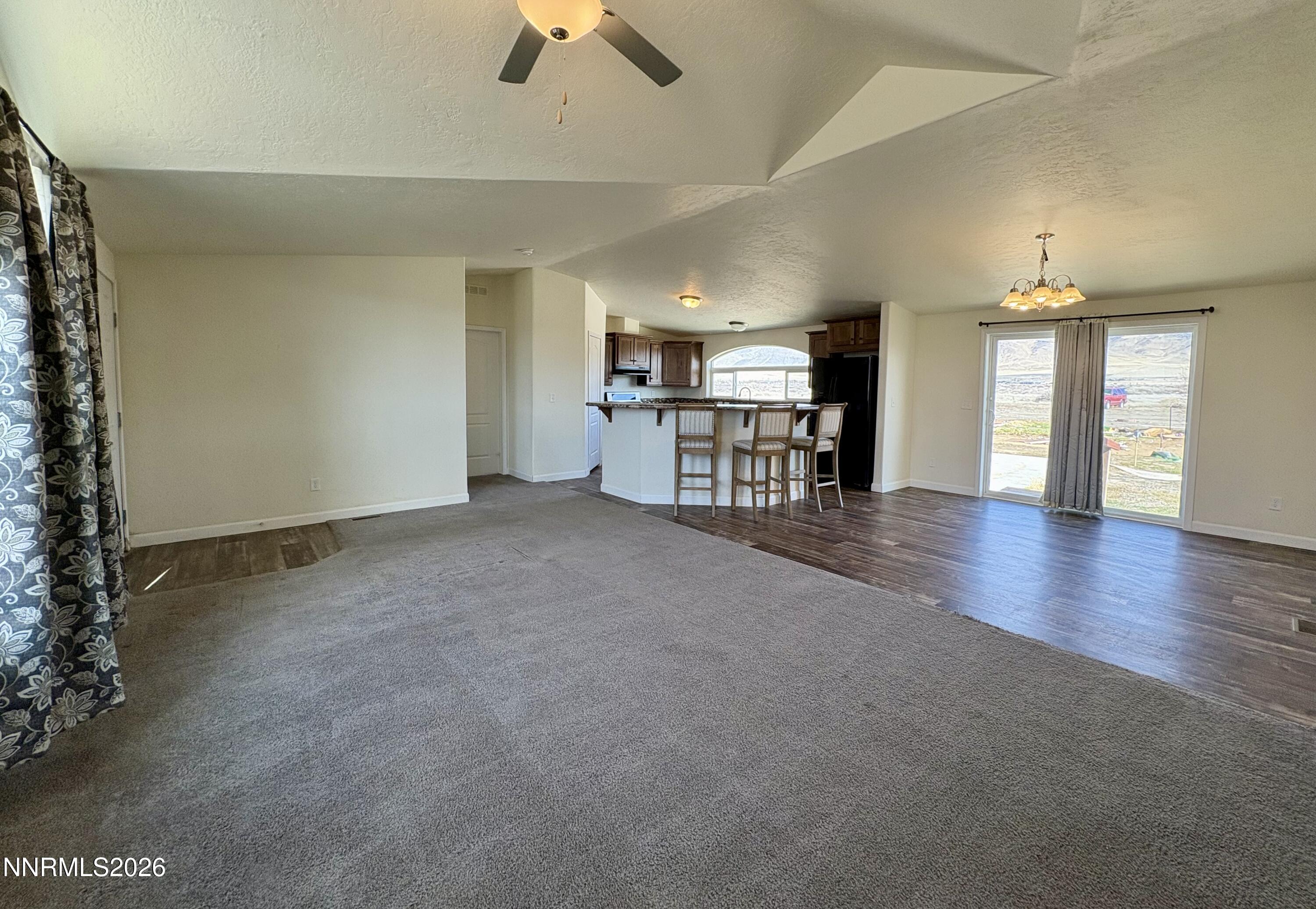 1415 Van Diest Road Winnemucca, NV 89445 - Photo 6 of 34 an empty room with furniture and chandelier