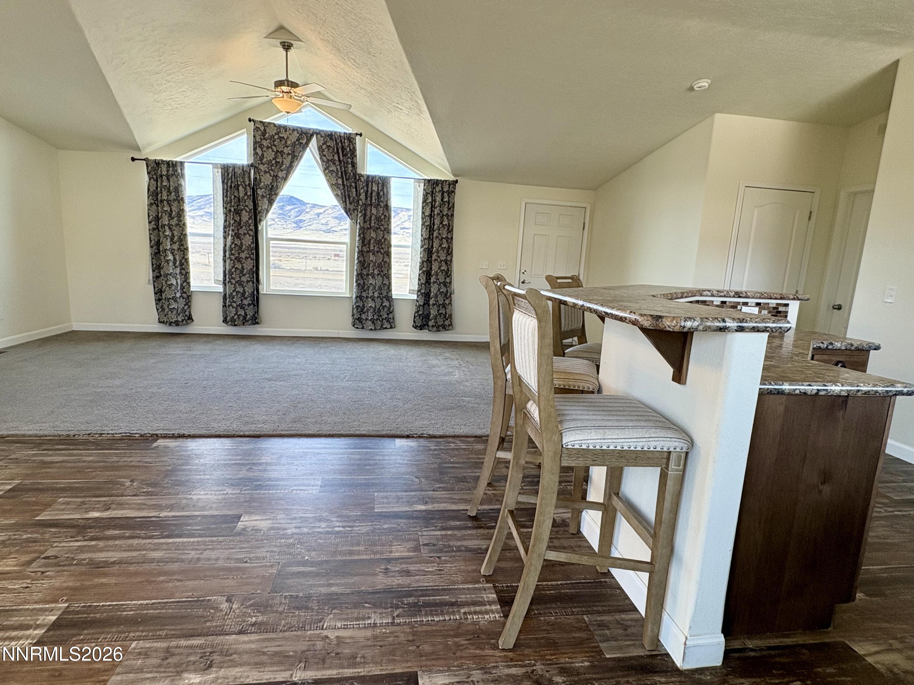 1415 Van Diest Road Winnemucca, NV 89445 - Photo 8 of 34 a living room with furniture and a window