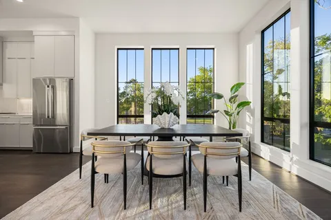 a kitchen with a table and chairs in it