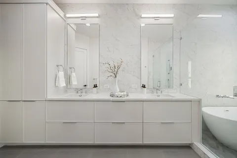a bathroom with a sink and mirror