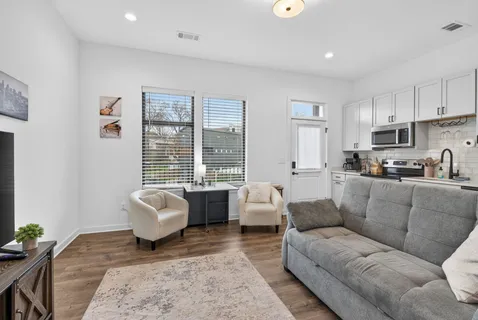 a living room with furniture or couch and a coffee table