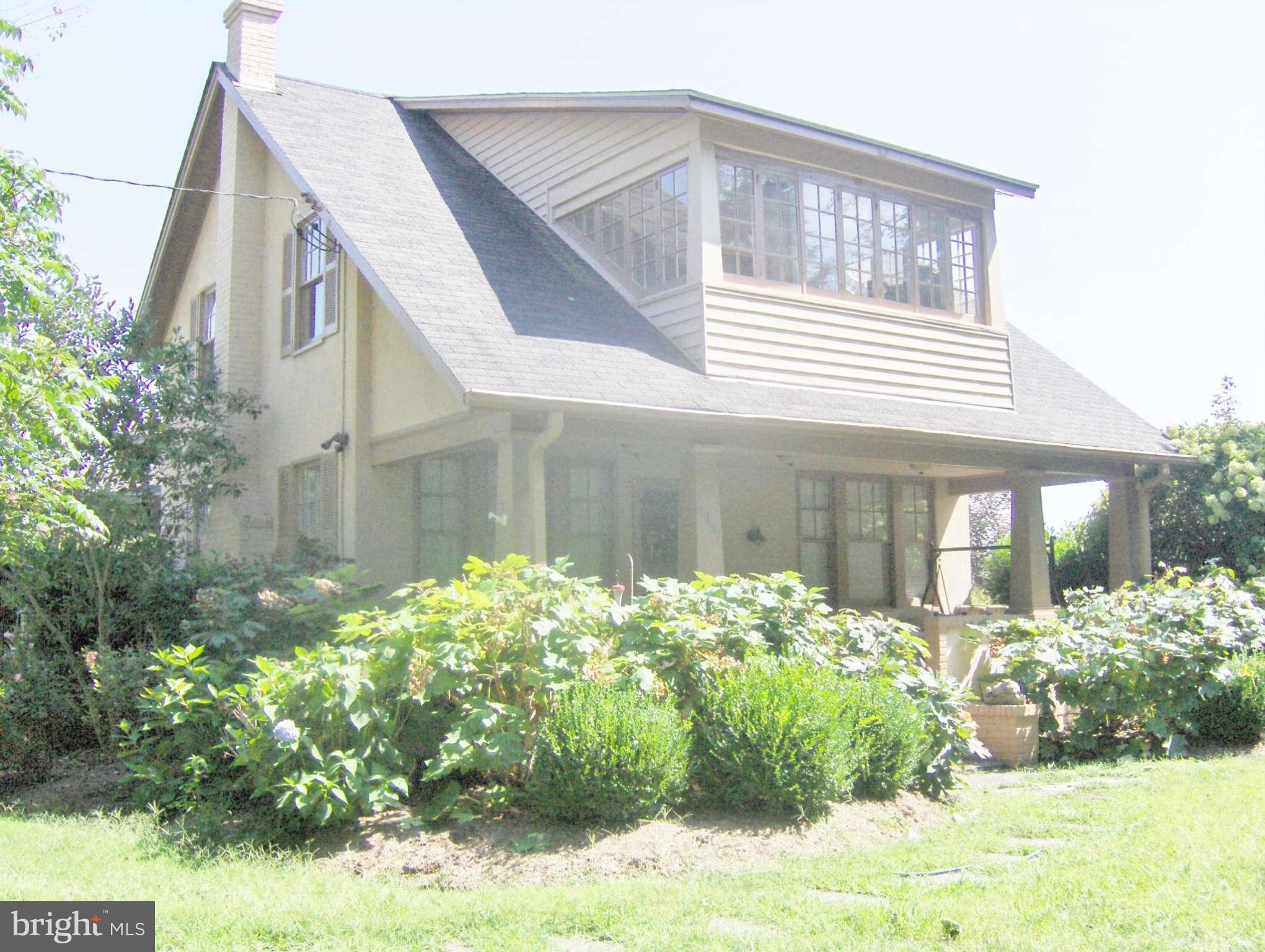 4957 Muddy Creek Road West River, MD 20778 - Photo 1 of 29 a front view of a house with garden