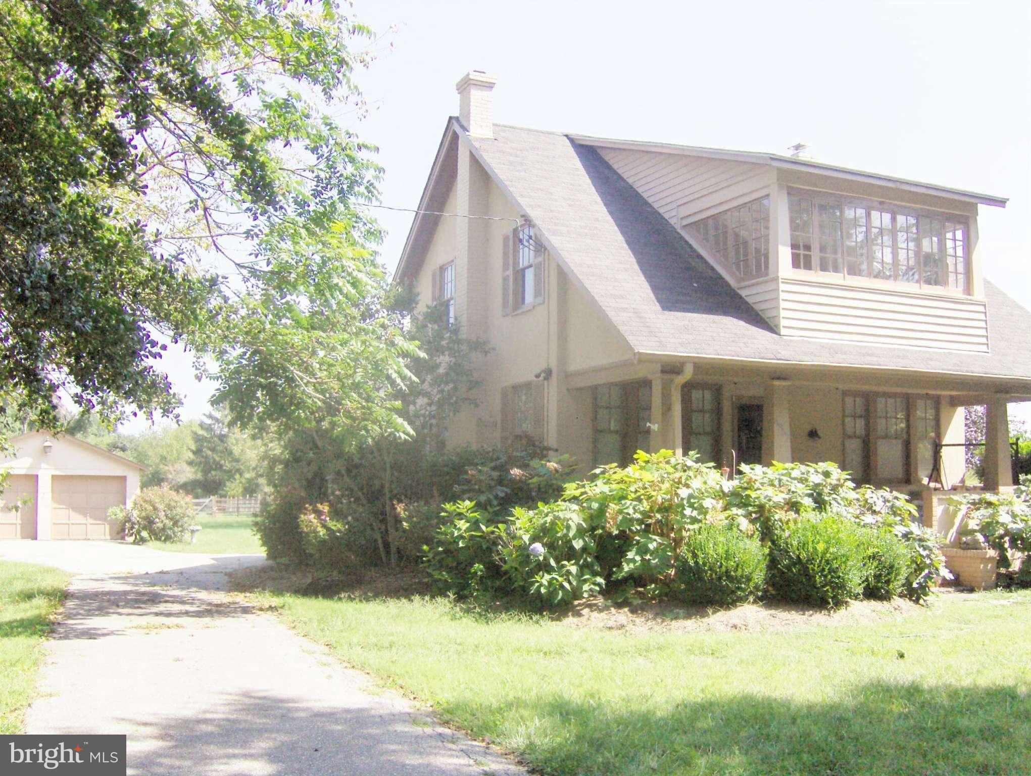 4957 Muddy Creek Road West River, MD 20778 - Photo 2 of 29 a view of a house with a yard and plants