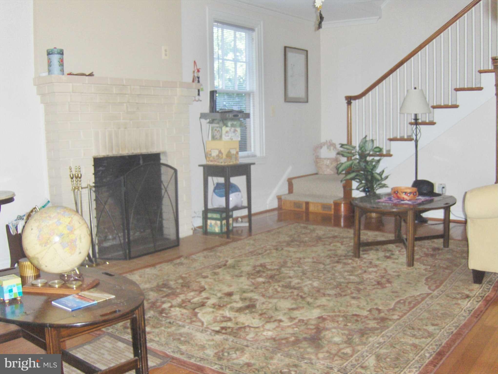 4957 Muddy Creek Road West River, MD 20778 - Photo 12 of 29 a living room with furniture and a fireplace