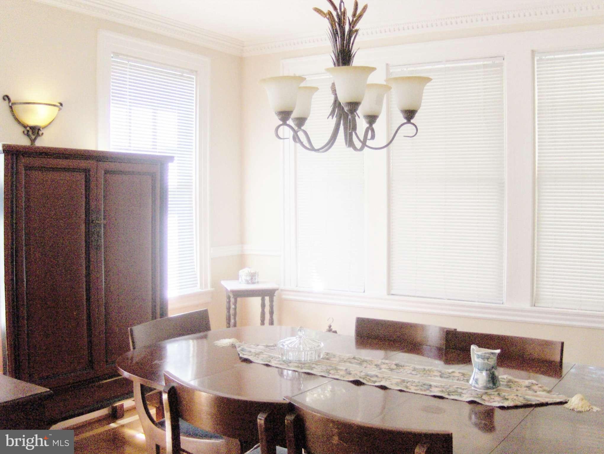 4957 Muddy Creek Road West River, MD 20778 - Photo 13 of 29 a view of a dining table and a table in a room