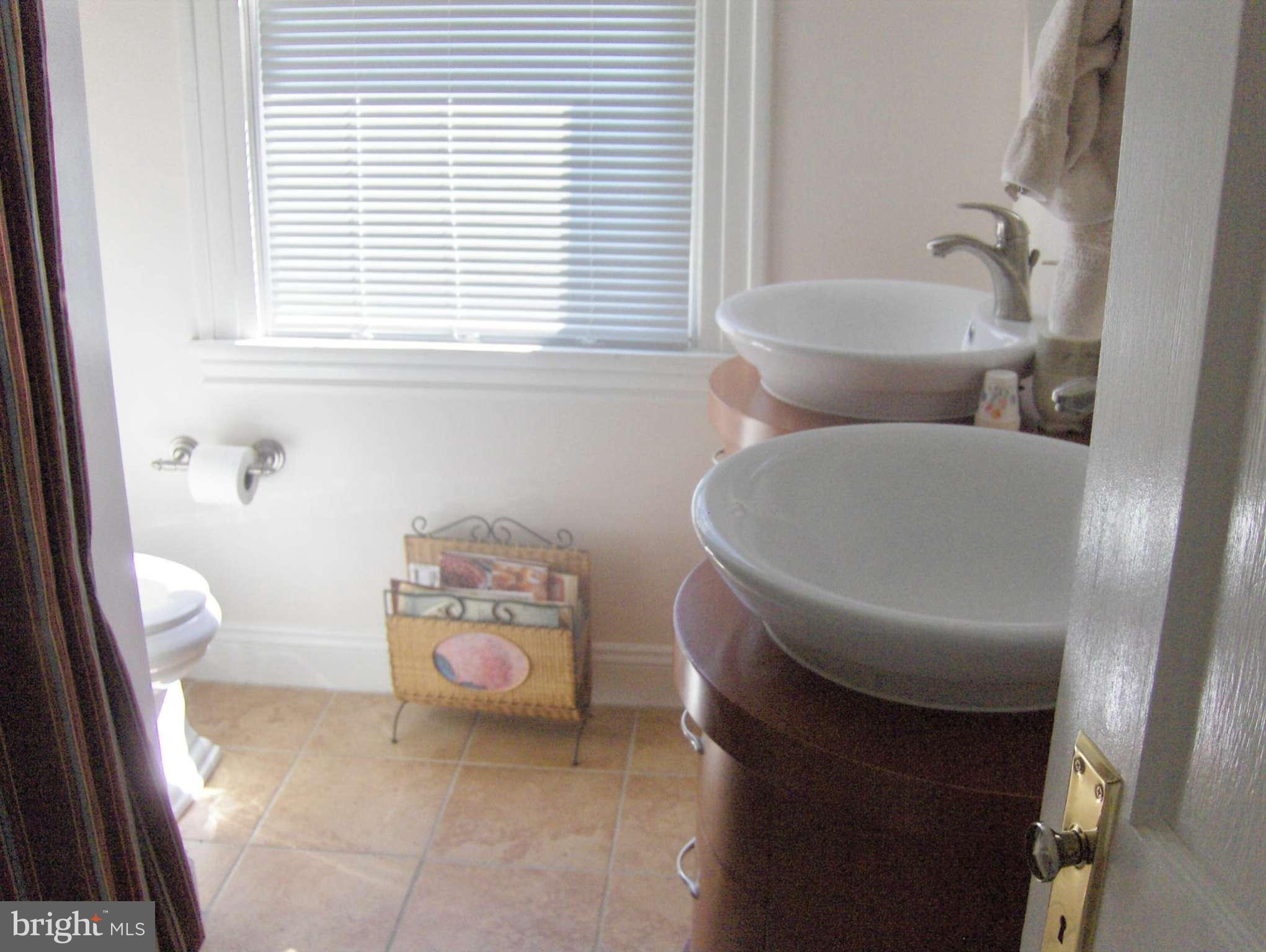 4957 Muddy Creek Road West River, MD 20778 - Photo 16 of 29 a bathroom with a toilet and a sink