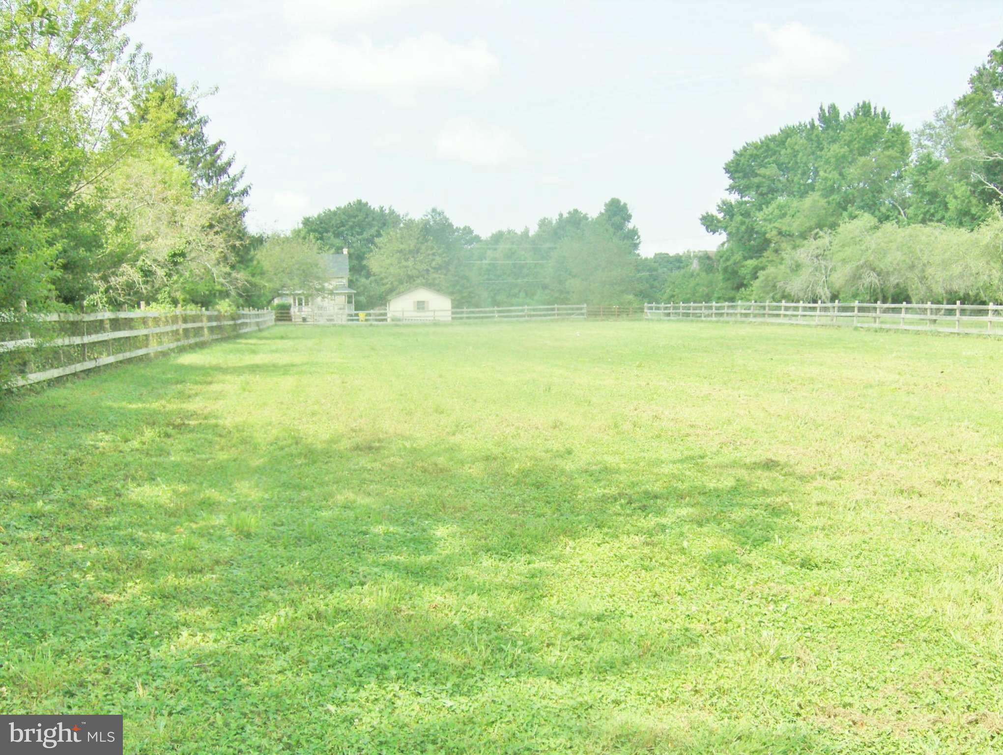 4957 Muddy Creek Road West River, MD 20778 - Photo 27 of 29 a view of a green field with trees in the background