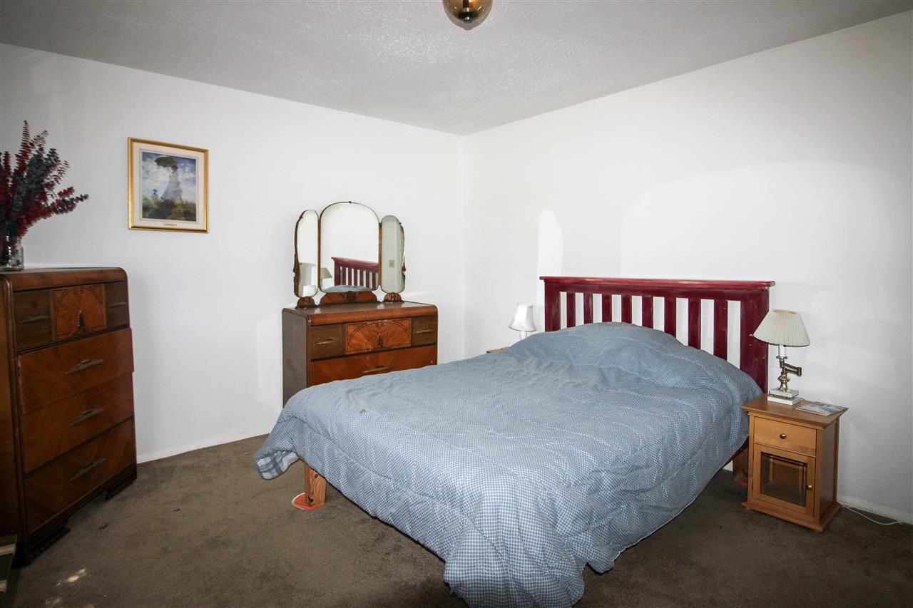 998 23 Road Grand Junction, CO 81505 - Photo 22 of 34 a bedroom with a bed and a dresser