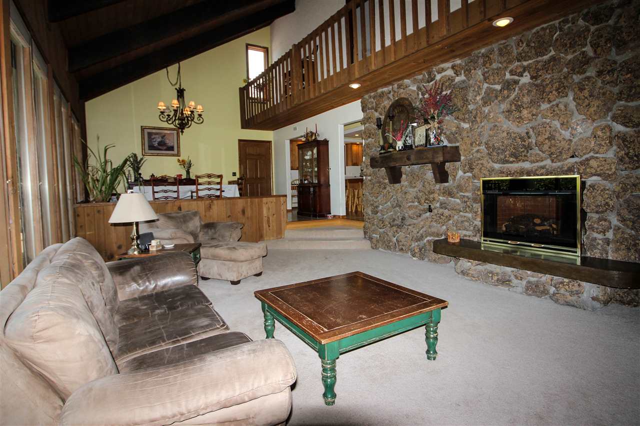 998 23 Road Grand Junction, CO 81505 - Photo 3 of 34 a living room with furniture and a fireplace