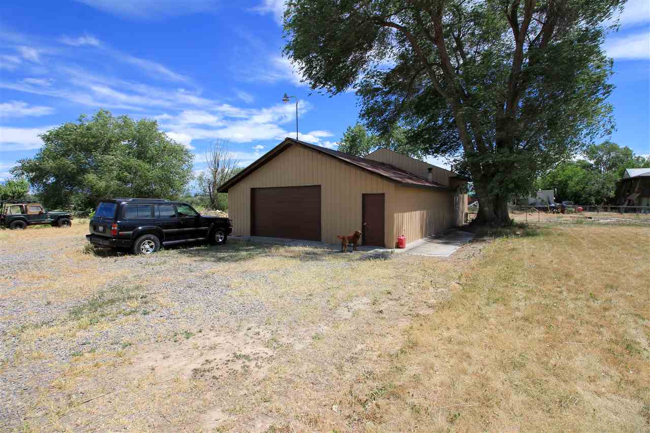 998 23 Road Grand Junction, CO 81505 - Photo 31 of 34 a car parked in front of house