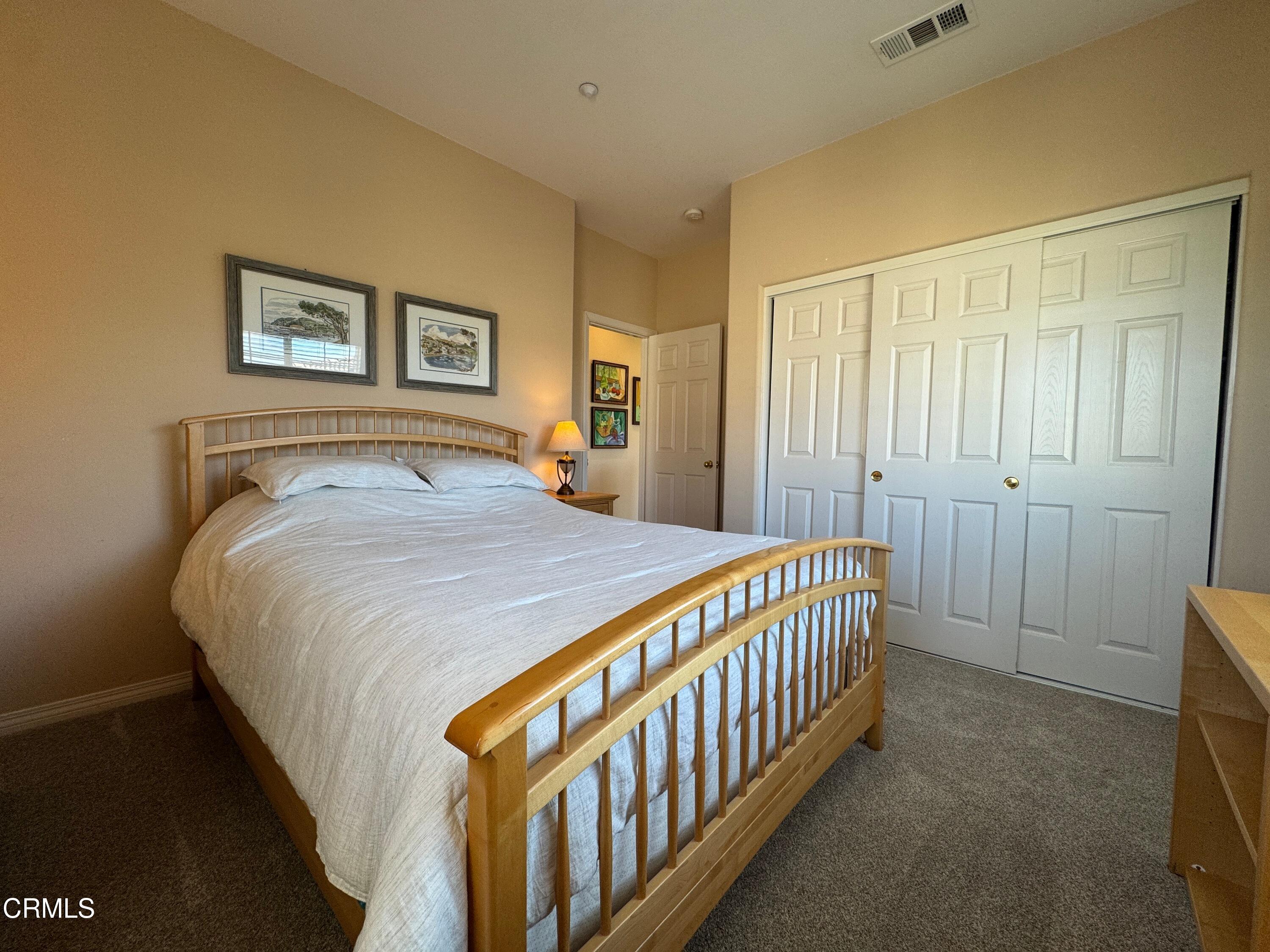 1240 Bayside Lane Oxnard, CA 93035 - Photo 36 of 69 a bedroom with a bed and a window