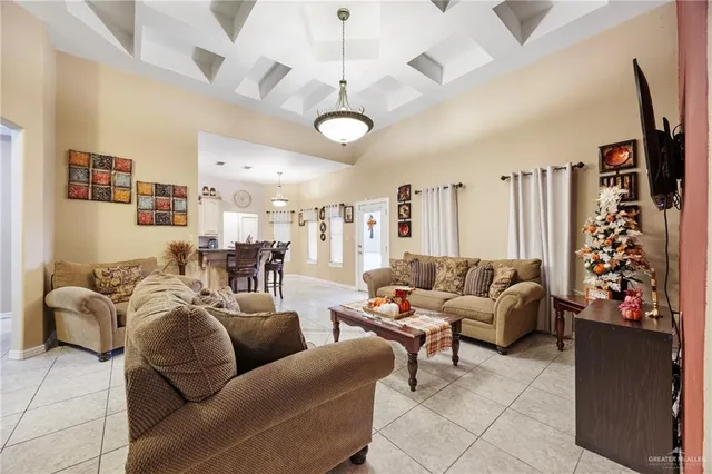 a living room with furniture ceiling fan and a rug