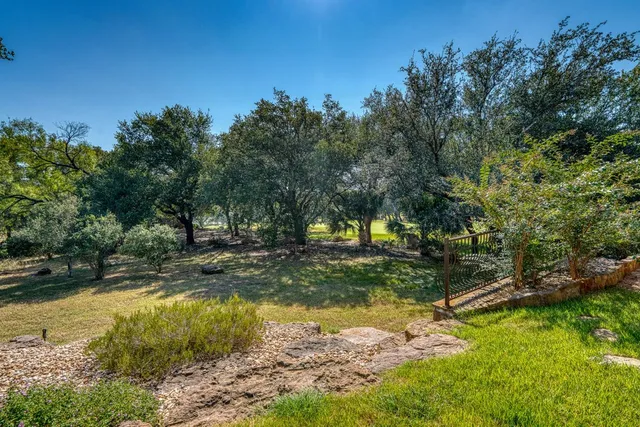 a view of a yard with swimming pool