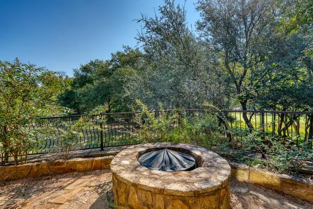 a view of a swimming pool in a backyard