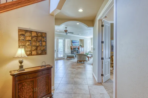 a view of a hallway with living room and dining room view