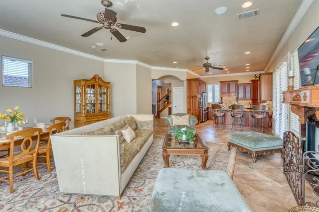 a living room with furniture kitchen view and a table