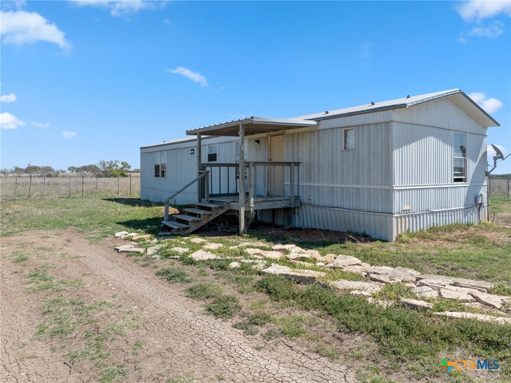996 County Road 421 Evant, TX 76525 - Photo 19 of 48 a view of a house with a yard