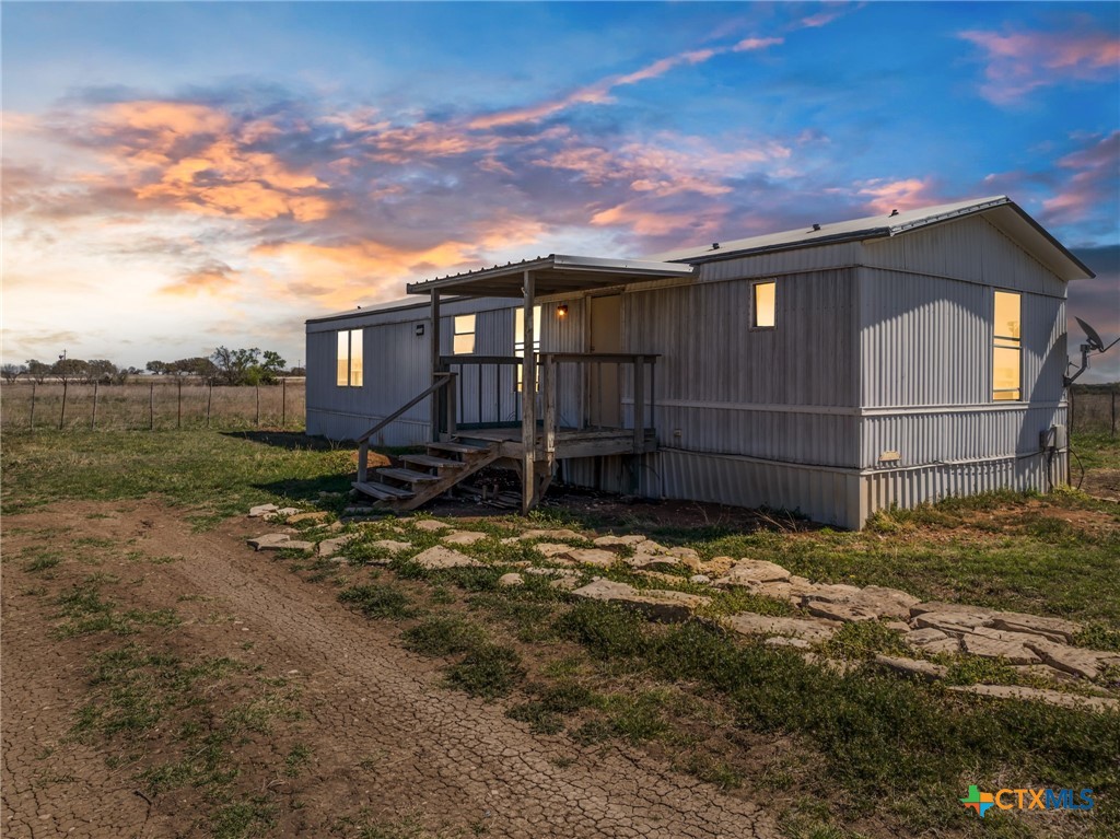 996 County Road 421 Evant, TX 76525 - Photo 20 of 48 a view of a house with a yard