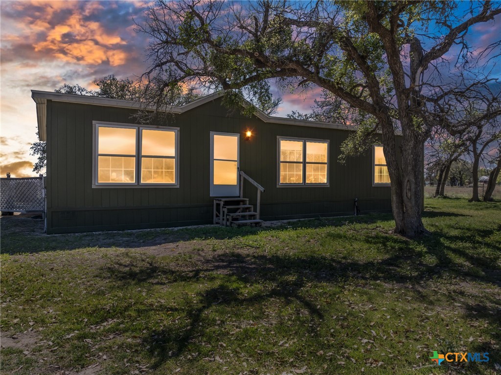 996 County Road 421 Evant, TX 76525 - Photo 2 of 48 a front view of house with yard and green space