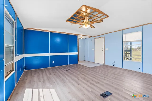 a bathroom with a granite countertop sink mirror and toilet