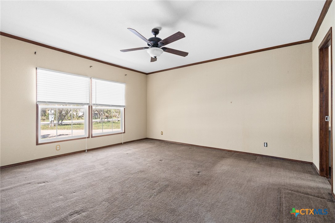 996 County Road 421 Evant, TX 76525 - Photo 9 of 48 an empty room with a window