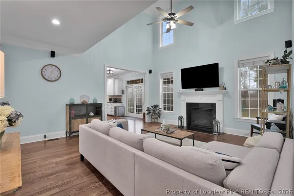 a kitchen with kitchen island granite countertop a sink a stove and cabinets