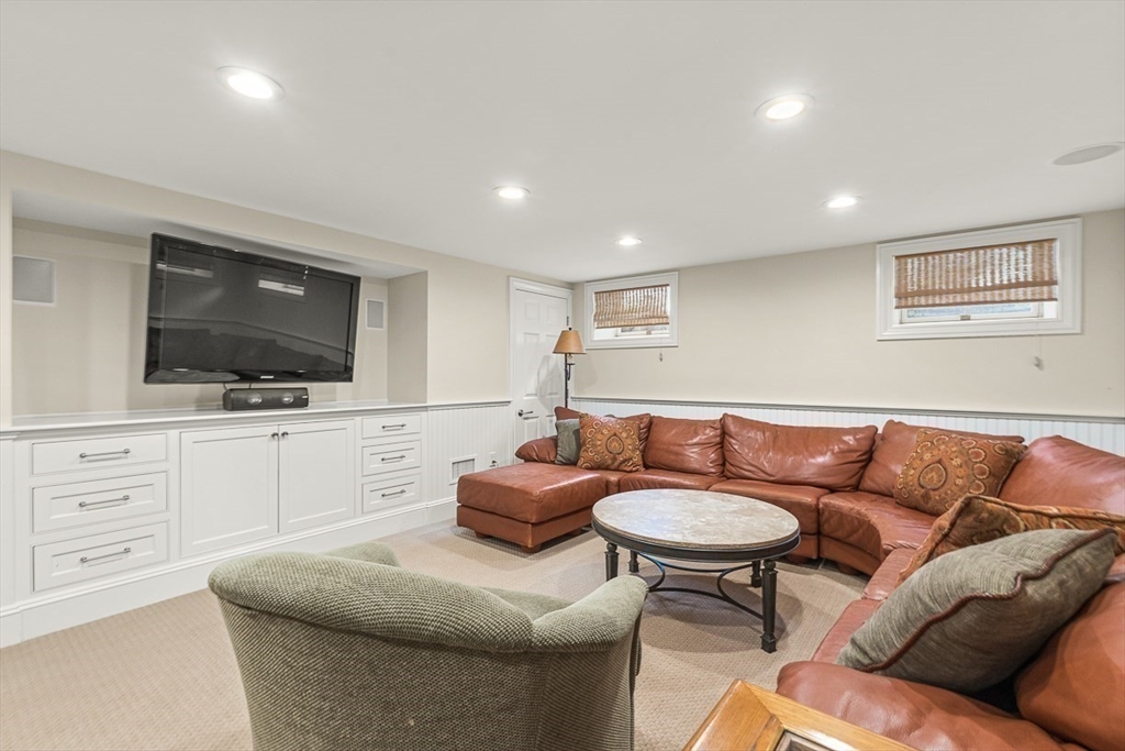 130 Bridle Trail Road Needham, MA 02492 - Photo 24 of 38 a living room with furniture and a flat screen tv