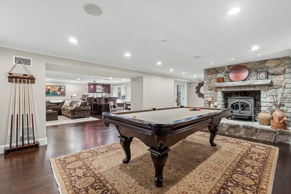 130 Bridle Trail Road Needham, MA 02492 - Photo 27 of 38 a room with furniture pool table and a fireplace