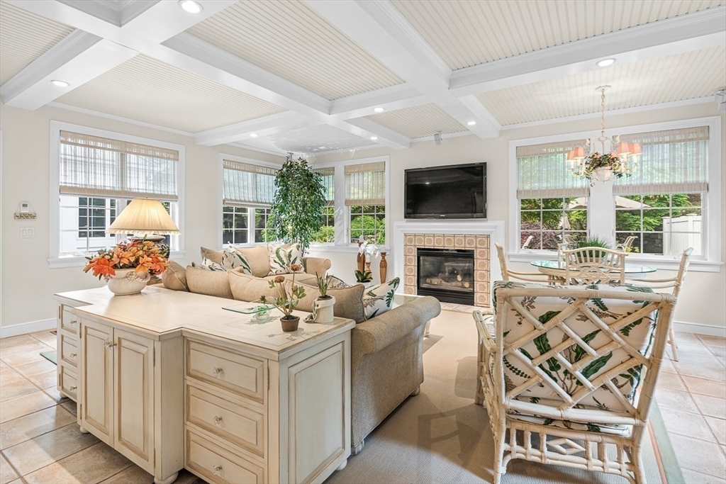 130 Bridle Trail Road Needham, MA 02492 - Photo 10 of 38 a living room with furniture a flat screen tv and a fireplace