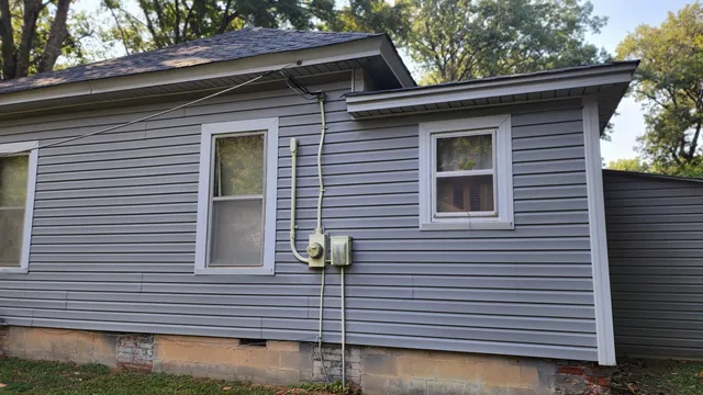 a view of a house and a large space