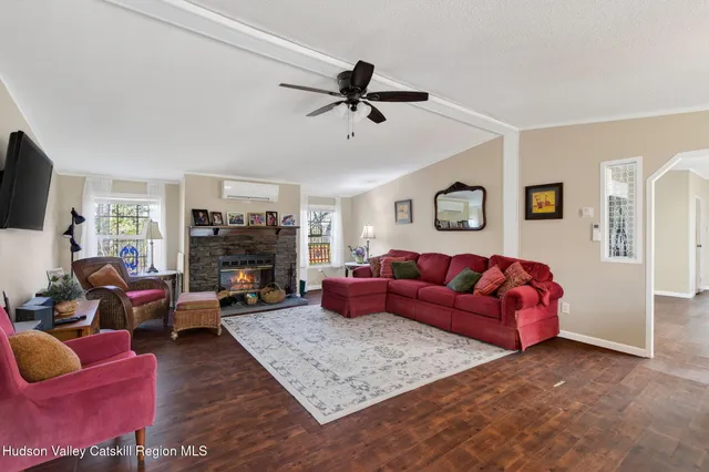 a living room with furniture or couch and a flat screen tv
