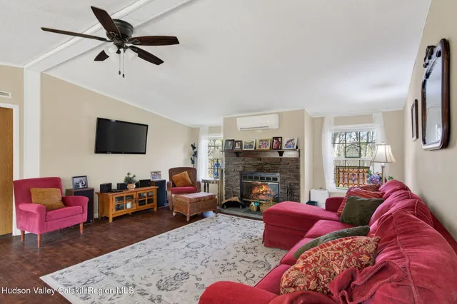 a living room with furniture or couch and a flat screen tv