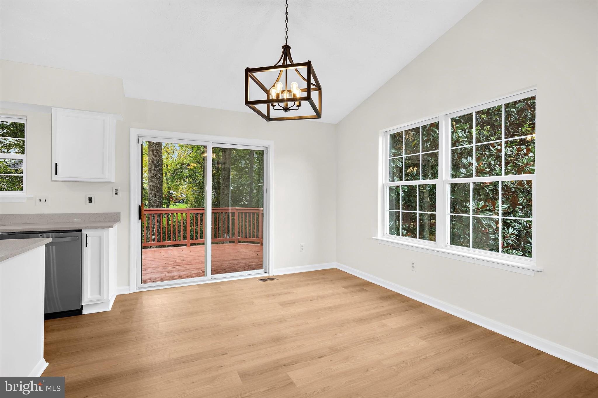 2335 Golden Chapel Road Odenton, MD 21113 - Photo 13 of 37 a view of an empty room with a window and wooden floor