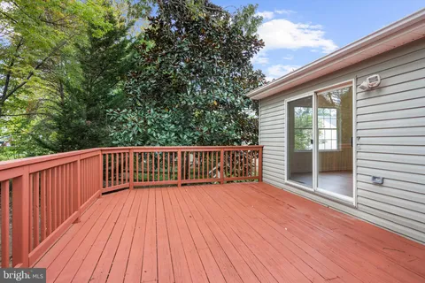 a view of balcony with wooden floor