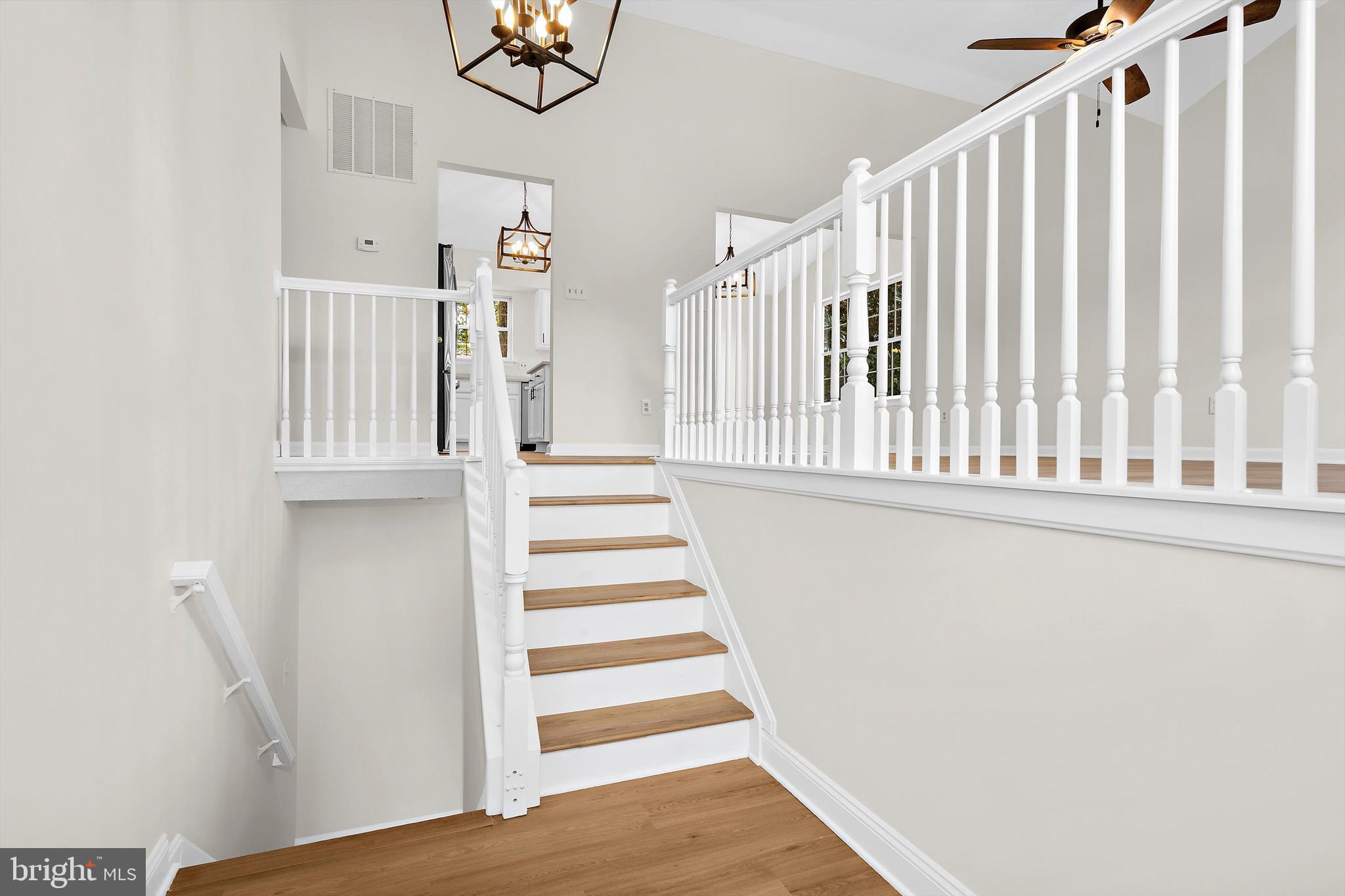 2335 Golden Chapel Road Odenton, MD 21113 - Photo 2 of 37 a view of entryway with stairs and wooden floor