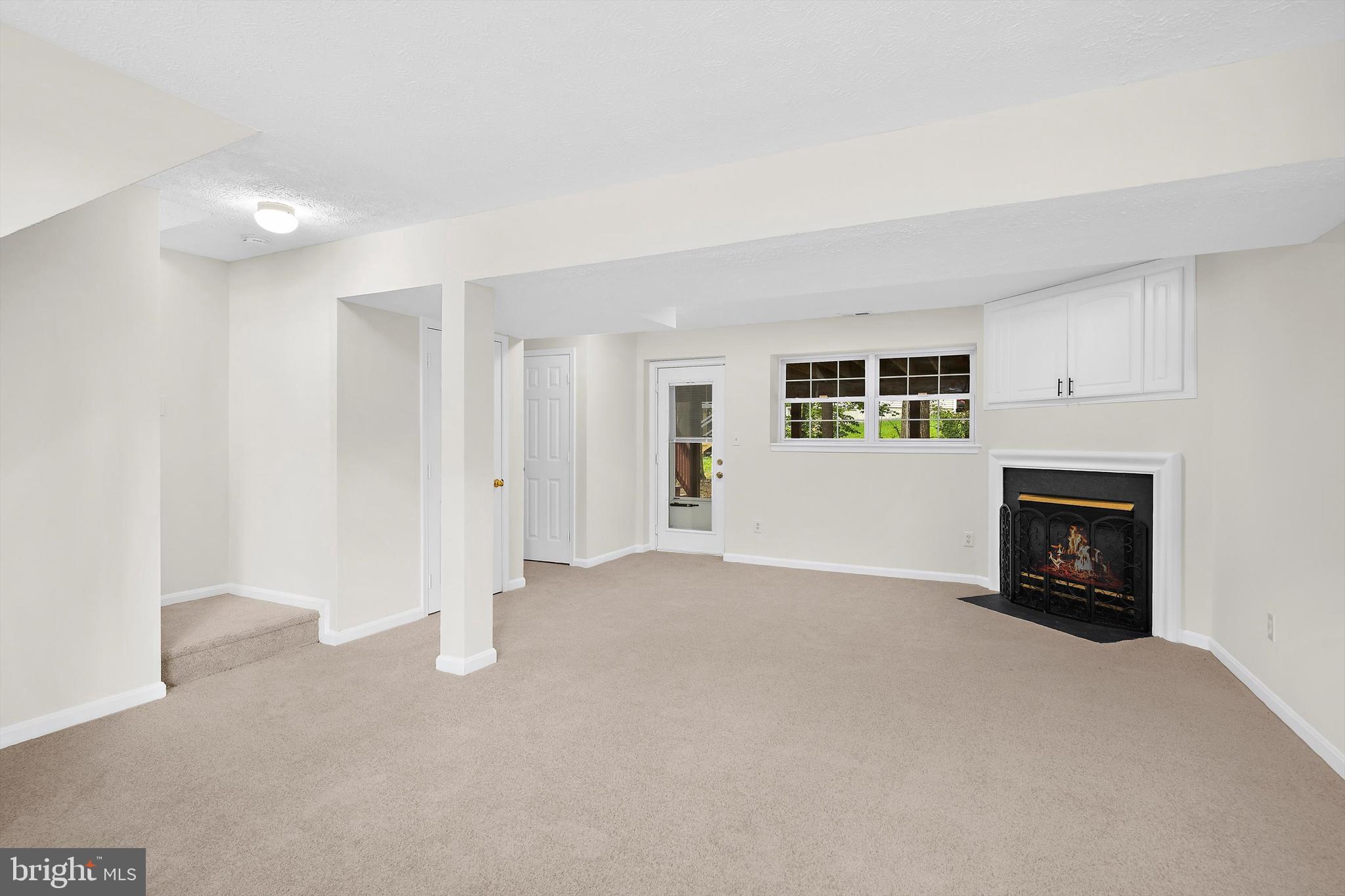 2335 Golden Chapel Road Odenton, MD 21113 - Photo 25 of 37 a view of an empty room with a fireplace