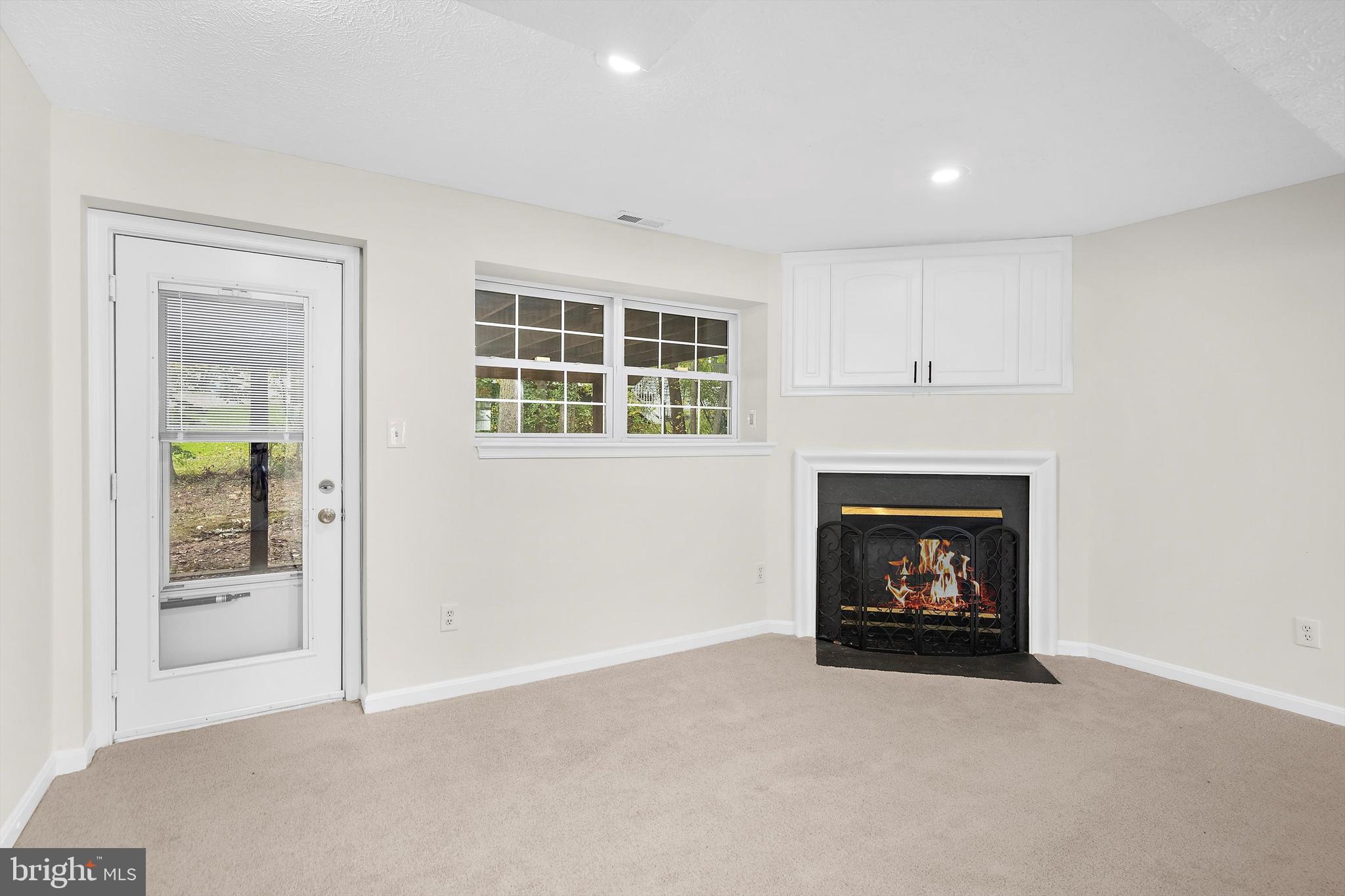 2335 Golden Chapel Road Odenton, MD 21113 - Photo 27 of 37 a living room with furniture and a fireplace