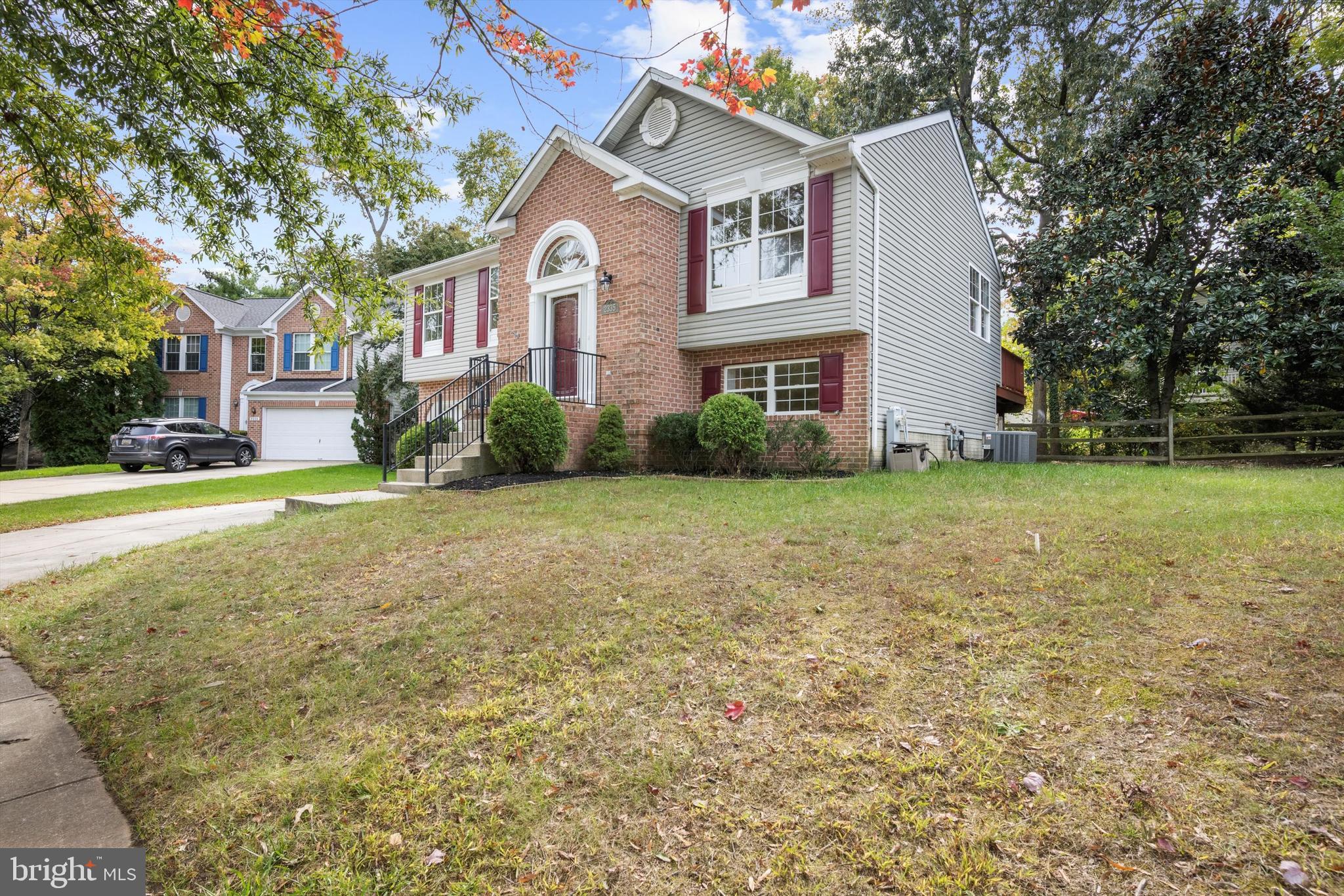 2335 Golden Chapel Road Odenton, MD 21113 - Photo 31 of 37 a view of a big house with a big yard and large trees