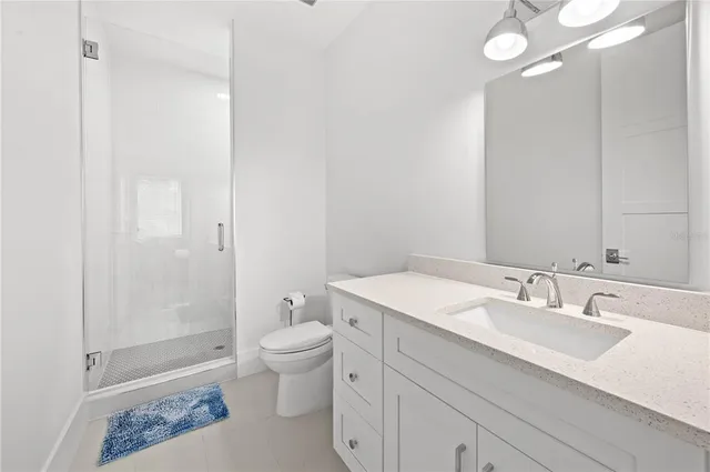 a view of house with a yard and potted plants