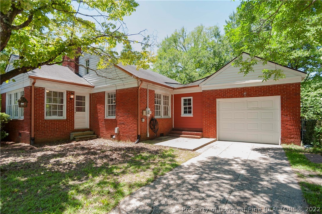 1904 Morganton Road Fayetteville, NC 28305 - Photo 14 of 45 a front view of a house with a yard and garage